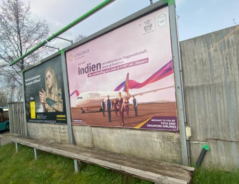 In Frankfurt, you can see two large billboards on a lawn. They display image advertising for the airline AirVistara.