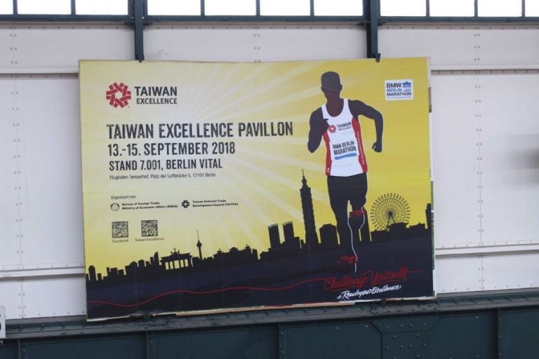 At a Berlin subway station, a large advertising space with the Taiwan Trade Centre promotion is visible front and center.