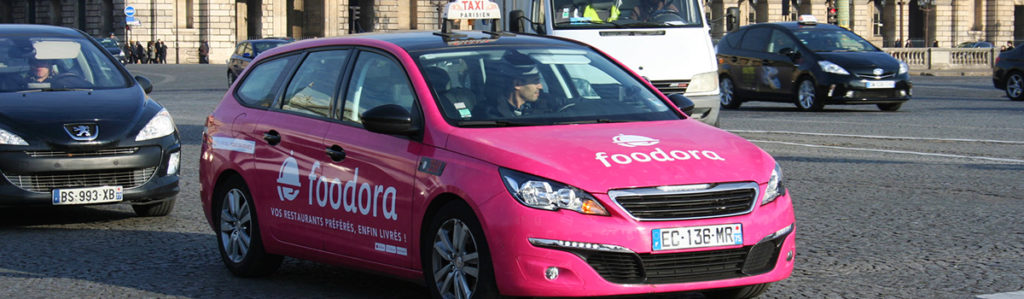 a pink taxi ad for "Foodora"
