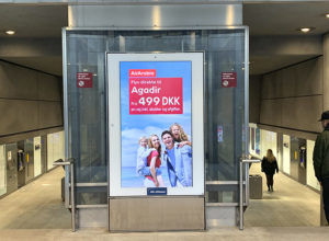 Advertisement for an airline on a digital screen.