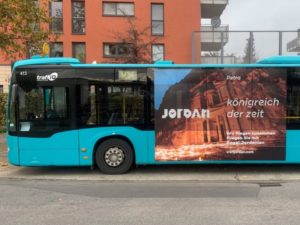 A bus with an out-of-home (OOH) advertisement promoting Jordan.