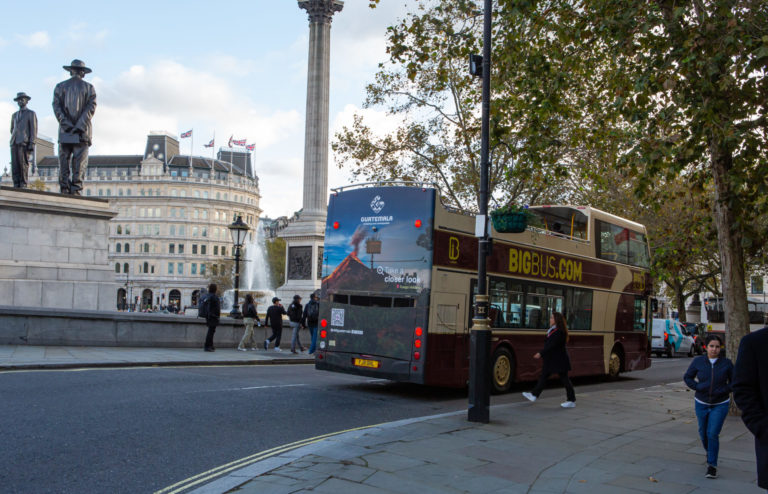 A so called "Big-Bus", the tourist bus in London, stops on a station.