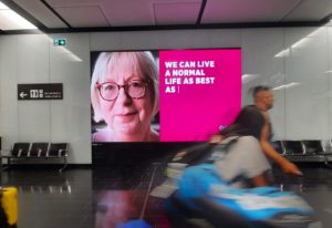 LED Video Wall at Vienna Airport. The out of home screen is 15 square meter big, positioned in the baggage collection hall to the exit. The campaign is in a bright pink design, promots for "Asthma" disease.