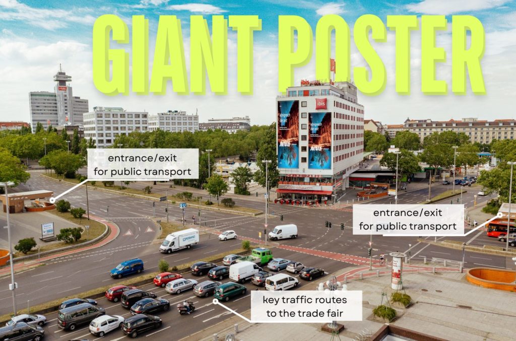 Giant poster on Berlin Ibis Hotel highlights the impact of Out-of-Home Advertising in 2025 during peak urban traffic.