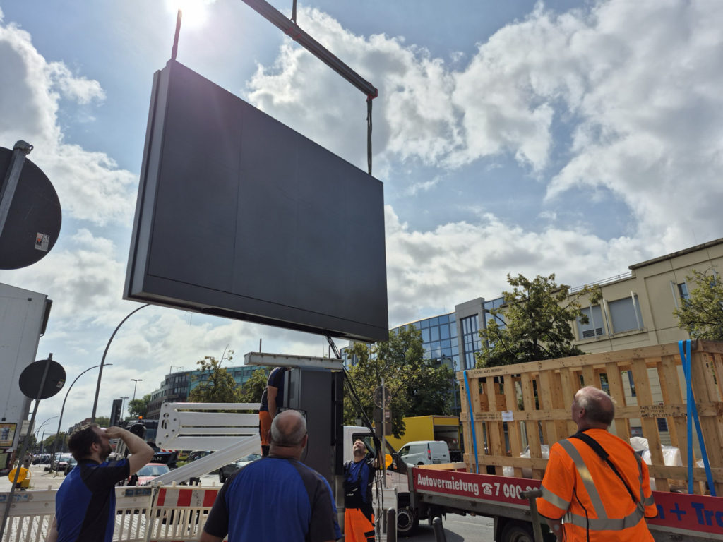 a digital screen at a street